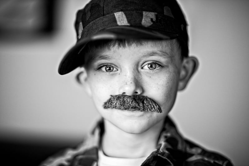 Child holding a reusable water bottle